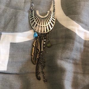 Long silver necklace with charms